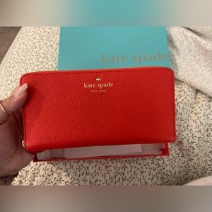 Red Kate Spade wallet with box. Great condition